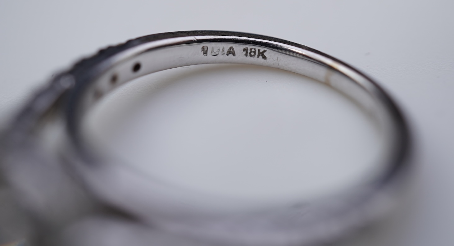 A diamond engagement ring and half eternity ring